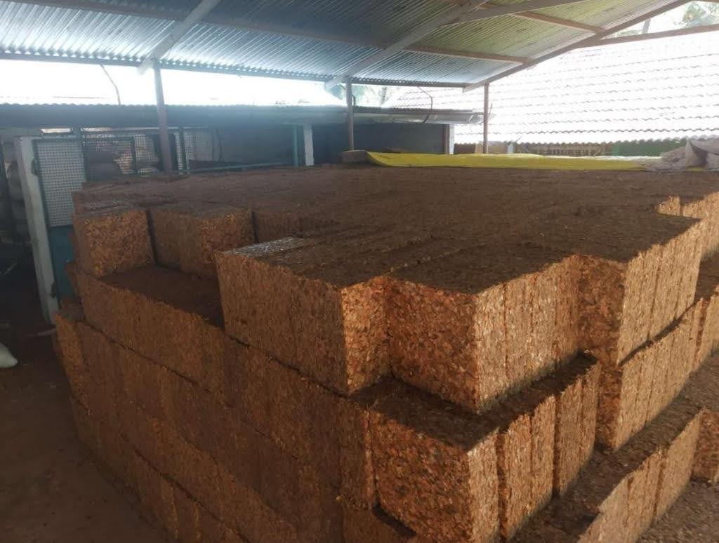 Coir Pith Blocks Stacked in Warehouse