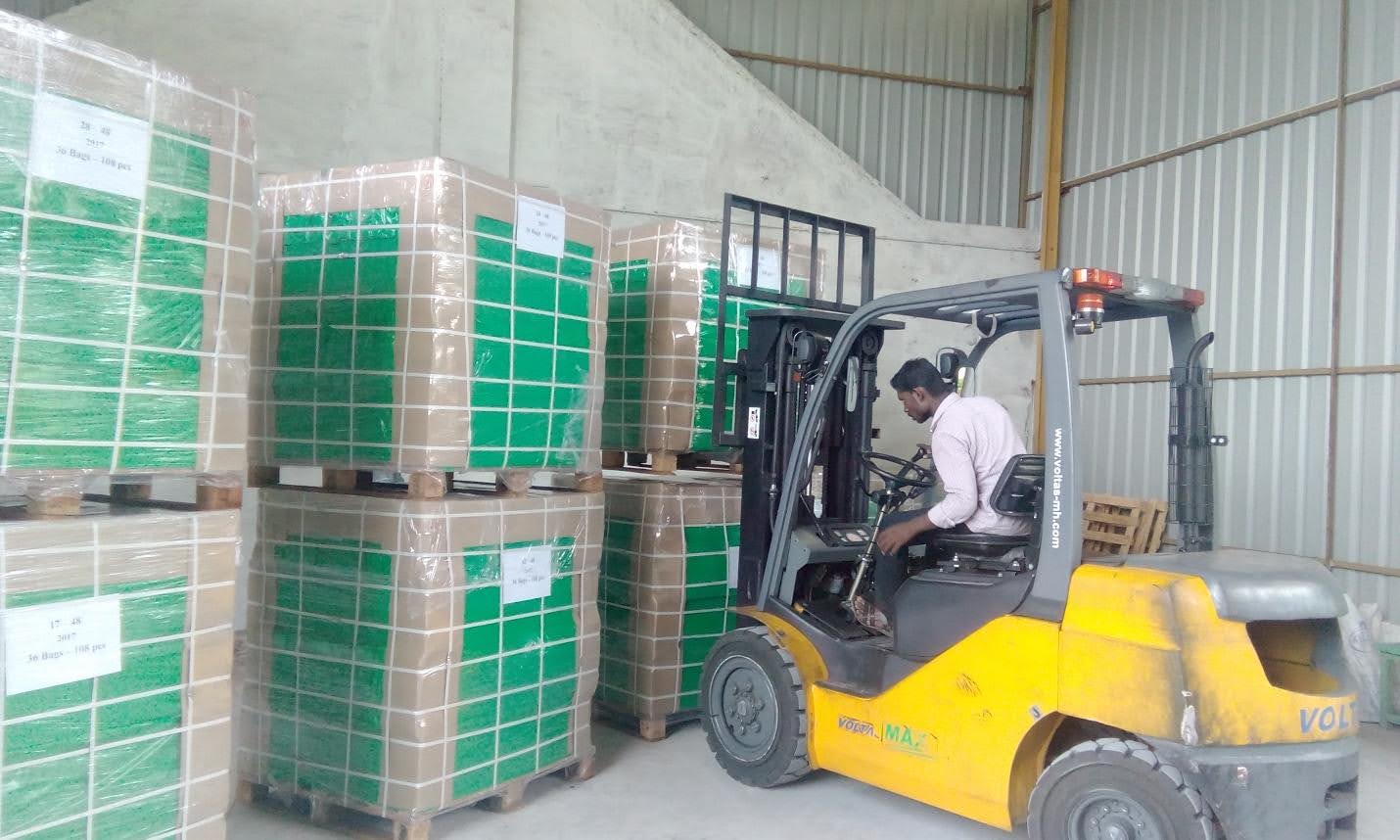 Coir Pith Blocks Stacked in Warehouse
